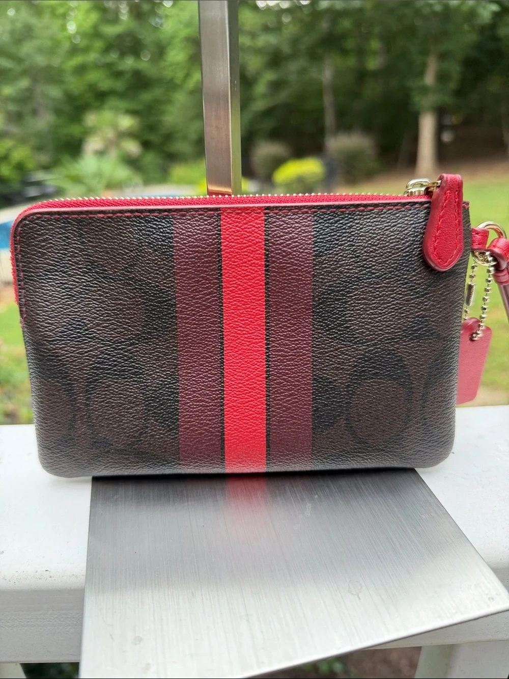 COACH Signature Stripe Zip Wristlet in Brown and Red